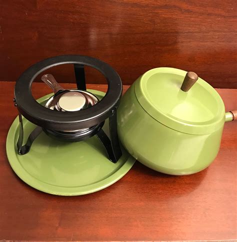 Contact information for splutomiersk.pl - Vintage fondue pot, plate alcohol burner and stand circa 1970s. Aluminum/stainless steel 2 quart pot done up in a retro avocado green color. Still wrapped in original plastic. New in the Box! This does not come with forks Manufactured by Fred Roberts Made in Japan